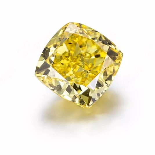 Cushion cut fancy yellow lab grown diamond with soft rounded corners and warm yellow hue